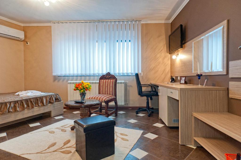 Postel nebo postele na pokoji v ubytování Garni Hotel Lama