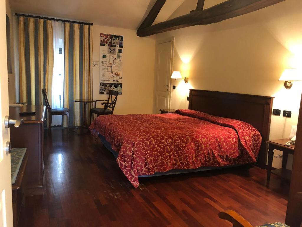 Postel nebo postele na pokoji v ubytování Villa Chiara Hotel