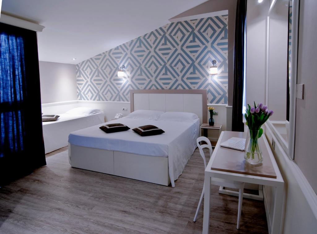 Łóżko lub łóżka w pokoju w obiekcie Hotel Golf