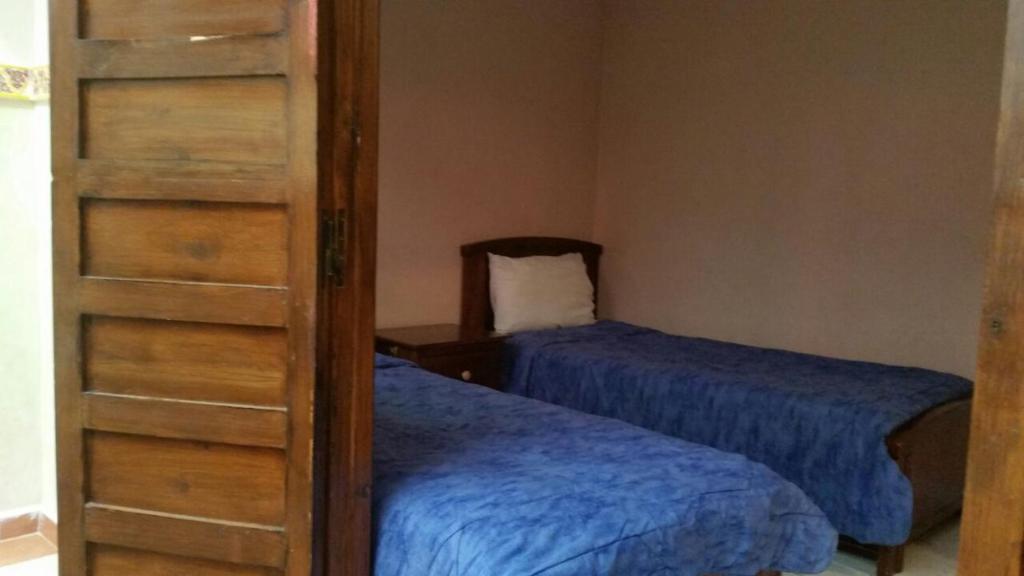 Postel nebo postele na pokoji v ubytování Riad familiale à Marrakech