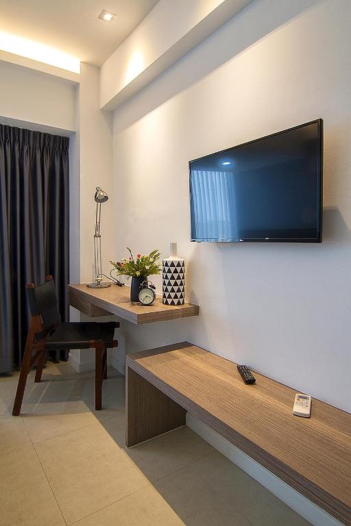 TV a/nebo společenská místnost v ubytování Bossotel Chiang Mai