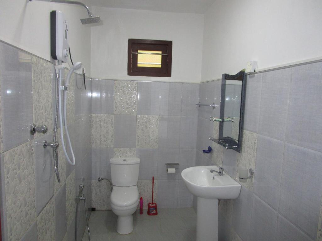 Koupelna v ubytování Maneesha Guest House