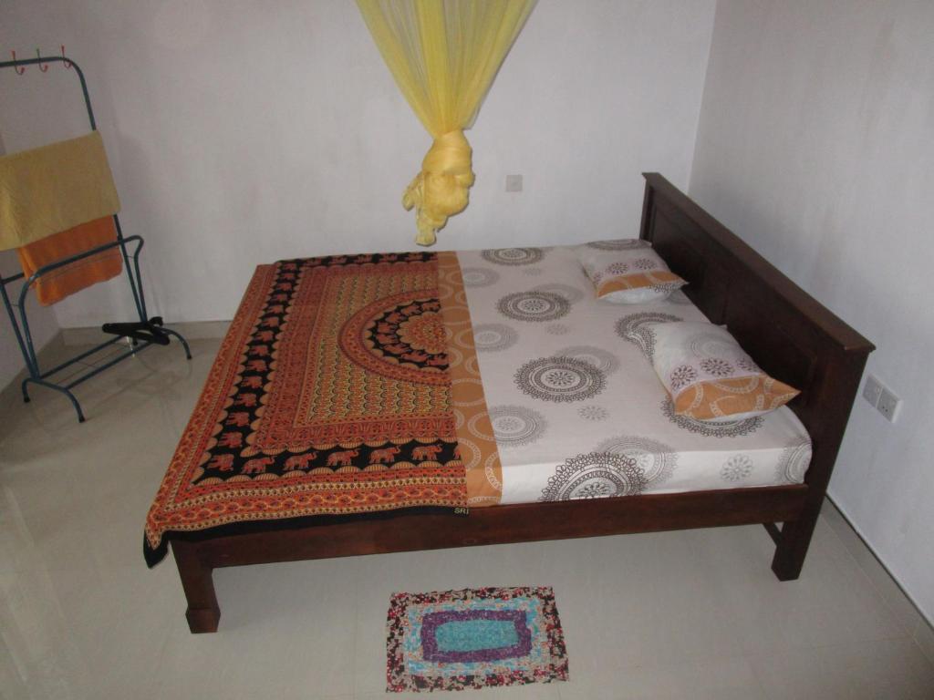 Postel nebo postele na pokoji v ubytování Maneesha Guest House