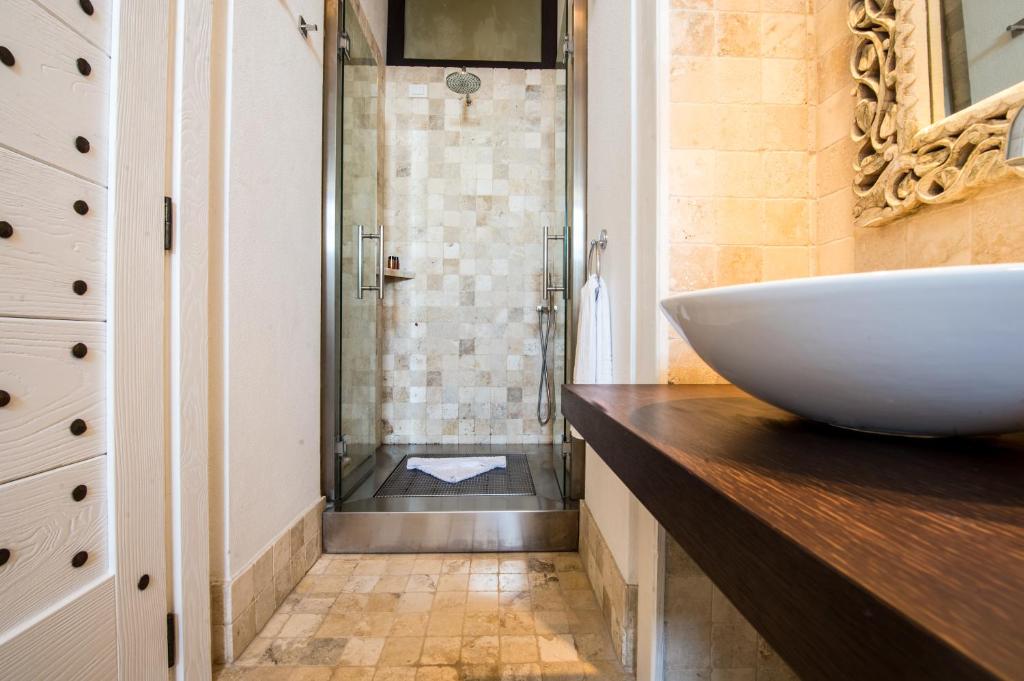 a bathroom with a sink and a shower at Faro Capo Spartivento in Chia