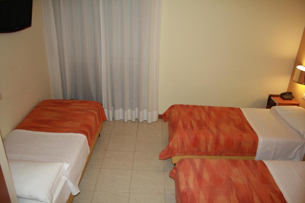 Postel nebo postele na pokoji v ubytování Hotel GF