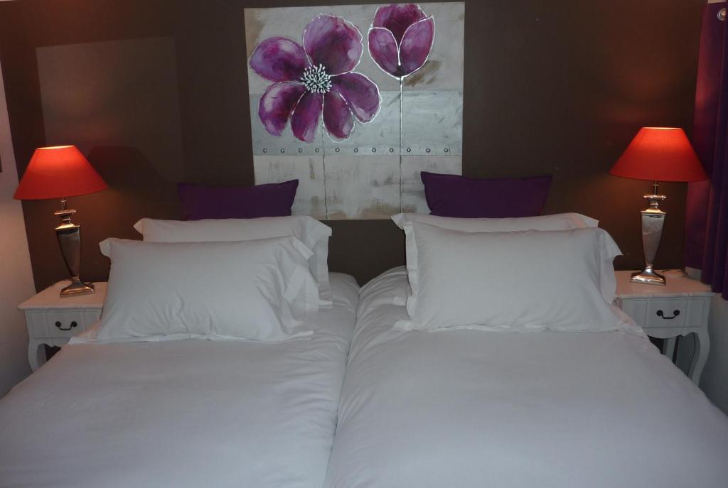 Postel nebo postele na pokoji v ubytování Hotel le P'tit Beaumont