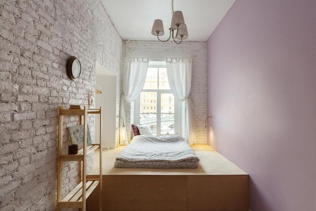 Ένα ή περισσότερα κρεβάτια σε δωμάτιο στο Forever Young Hostel