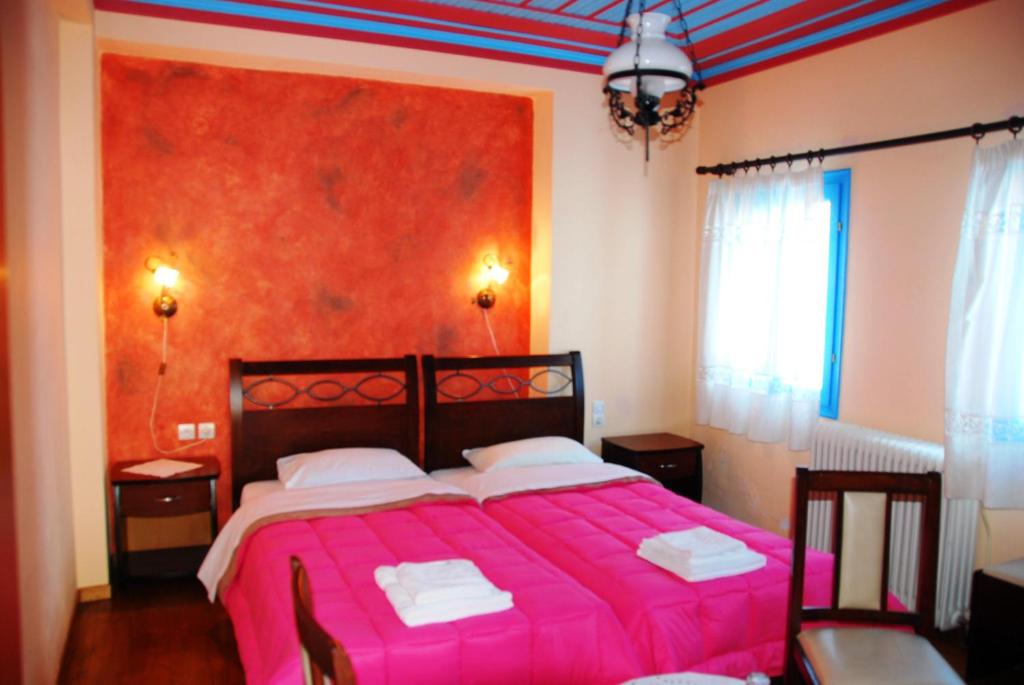 Postel nebo postele na pokoji v ubytování Hotel Ladias