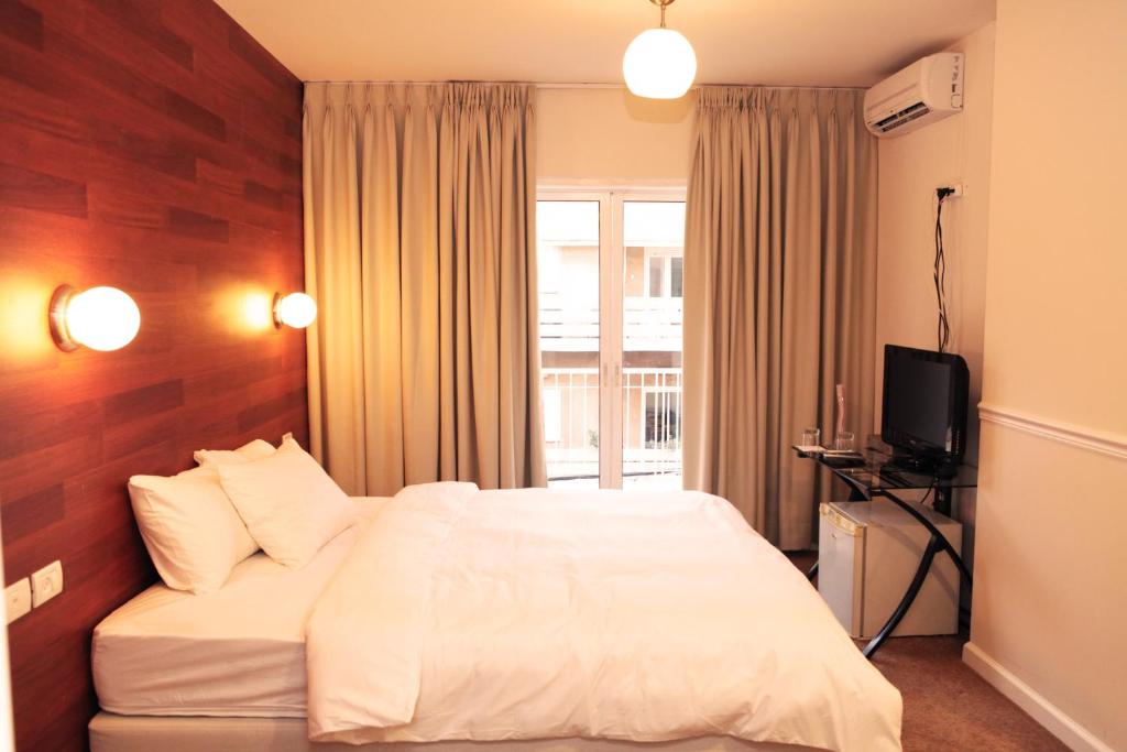 Postel nebo postele na pokoji v ubytování Idelson Hotel