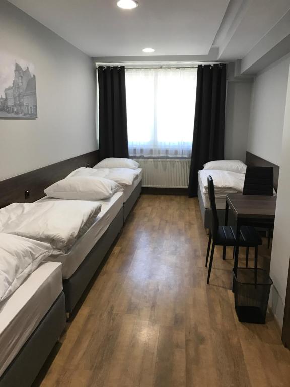 Posteľ alebo postele v izbe v ubytovaní Noclegi Mikołów