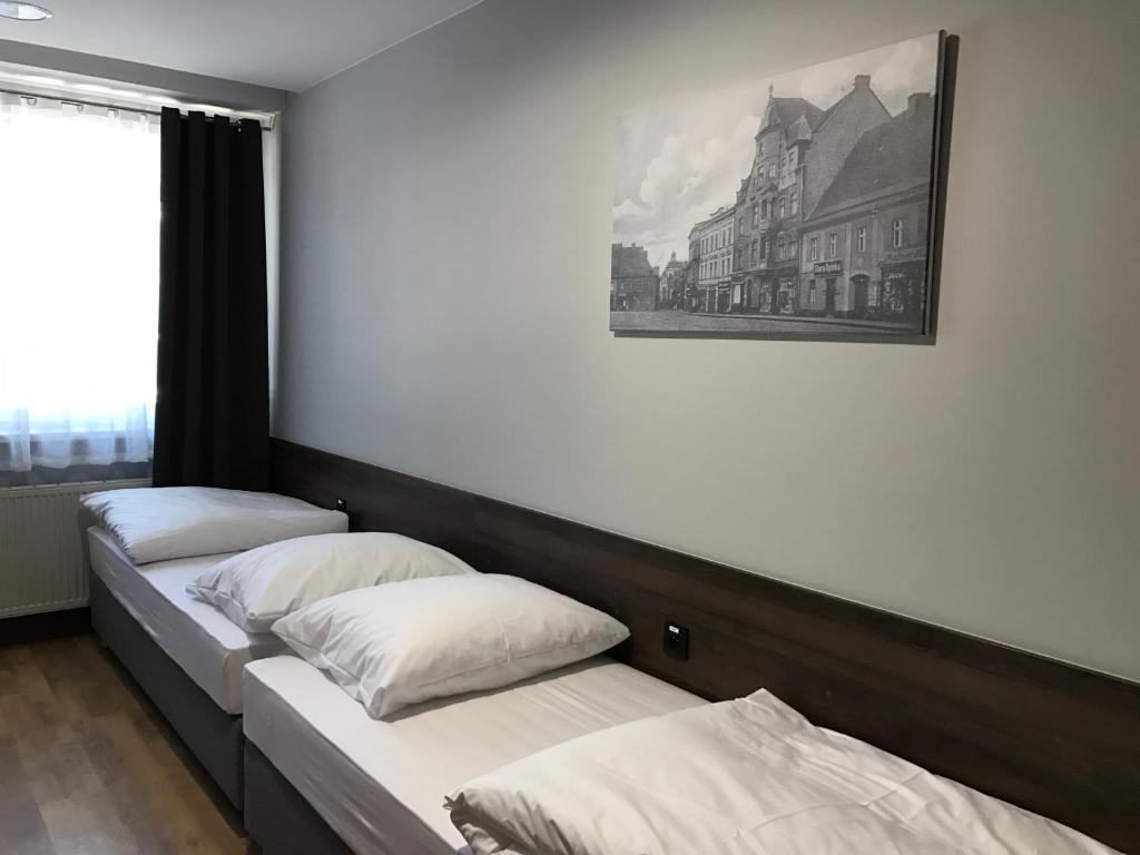 Posteľ alebo postele v izbe v ubytovaní Noclegi Mikołów
