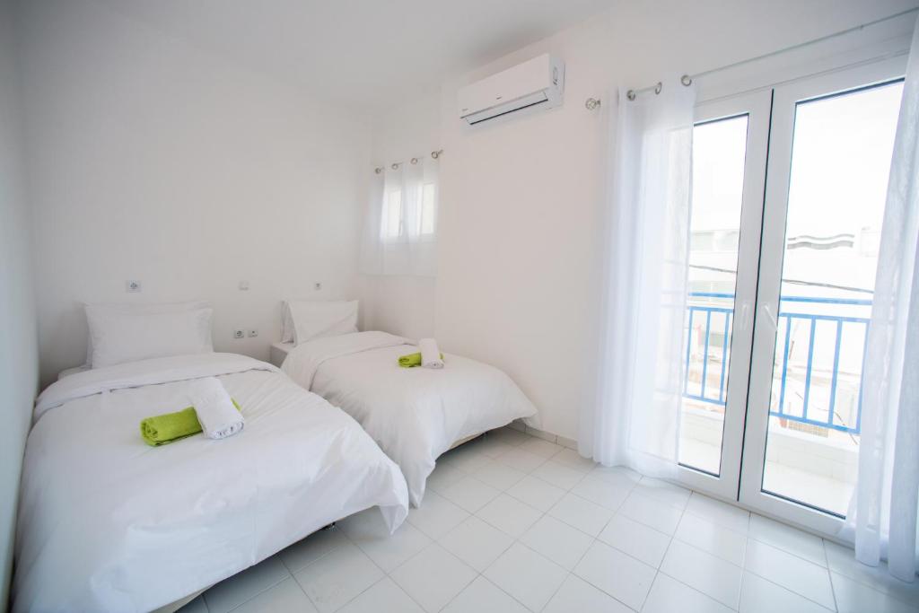 Кровать или кровати в номере Sea View Apartments