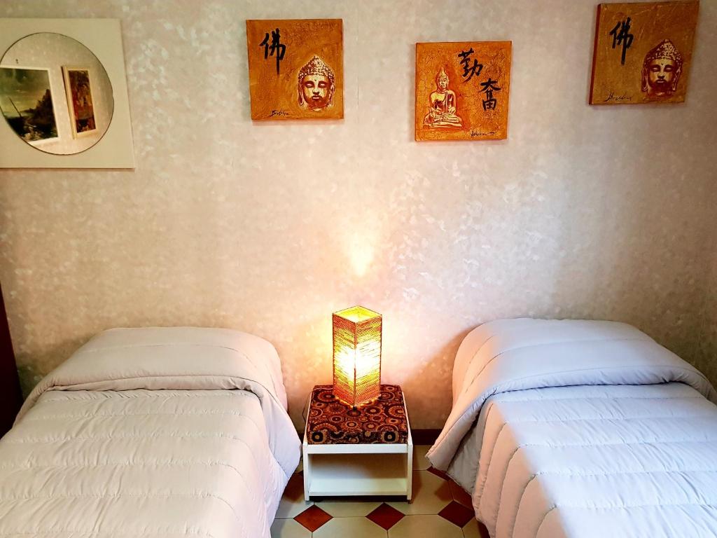 Postel nebo postele na pokoji v ubytování Catania house Apartment