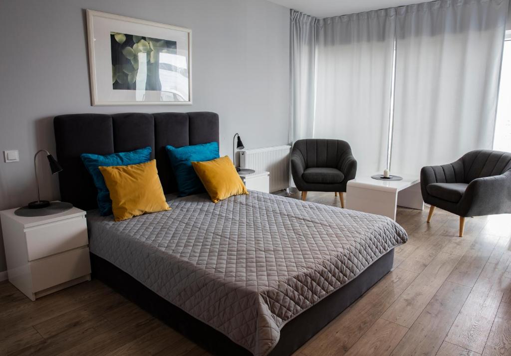 Postel nebo postele na pokoji v ubytování Apartamenty I.M.A Towarowa