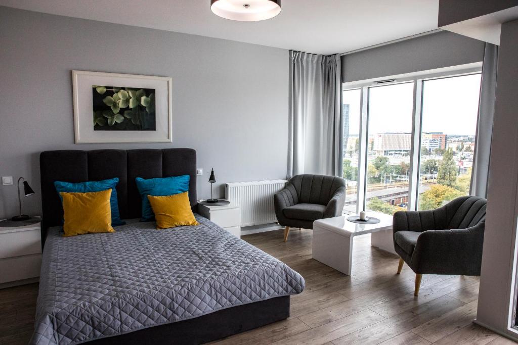 Postel nebo postele na pokoji v ubytování Apartamenty I.M.A Towarowa