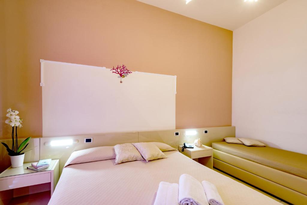 Postel nebo postele na pokoji v ubytování Hotel Cirillo Family Club - All Inclusive
