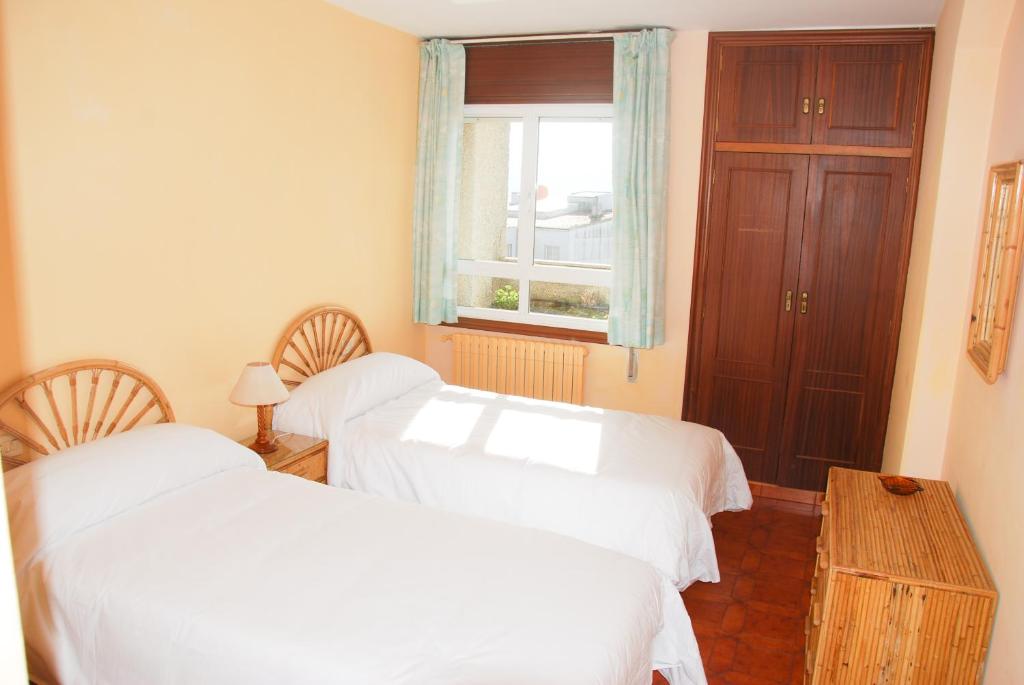 Postel nebo postele na pokoji v ubytování Apartamentos Granxola