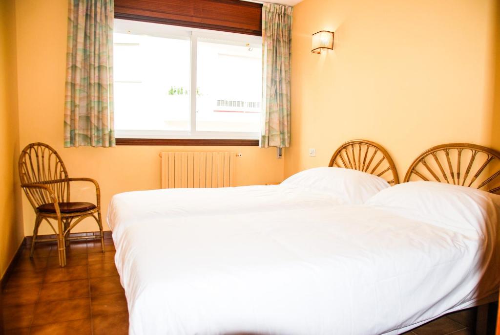 Postel nebo postele na pokoji v ubytování Apartamentos Granxola