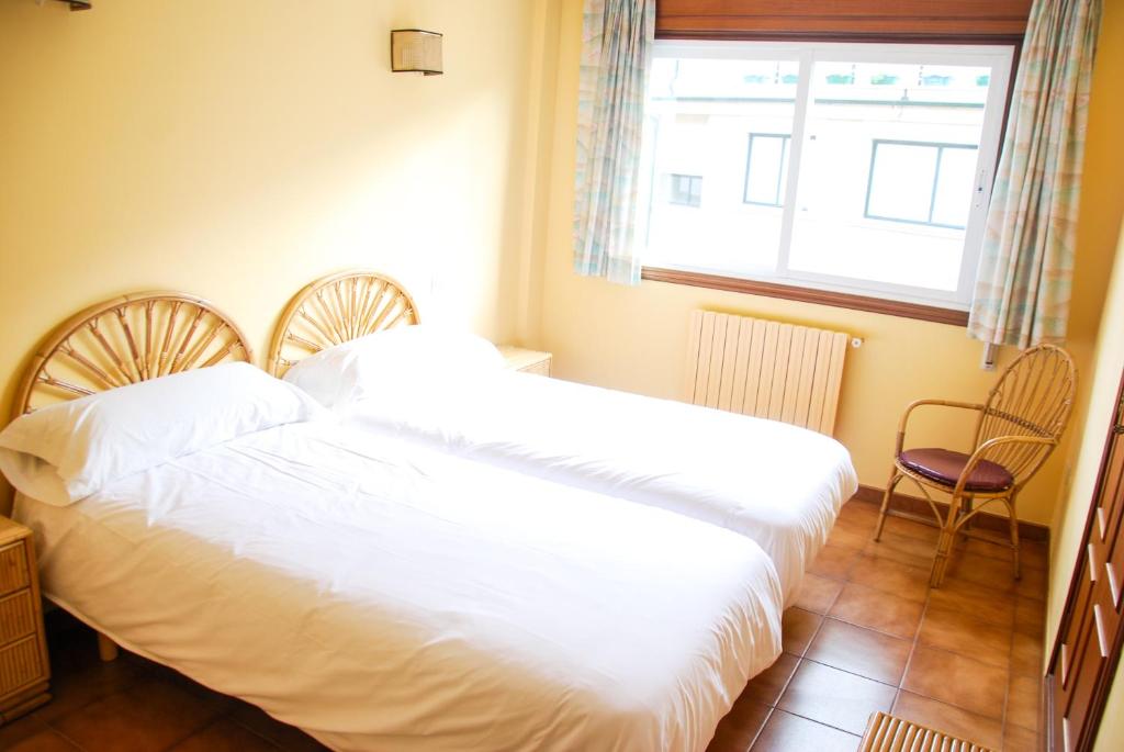 Postel nebo postele na pokoji v ubytování Apartamentos Granxola