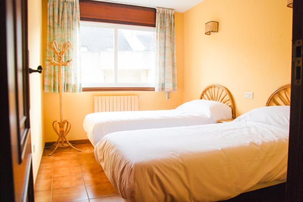 Postel nebo postele na pokoji v ubytování Apartamentos Granxola