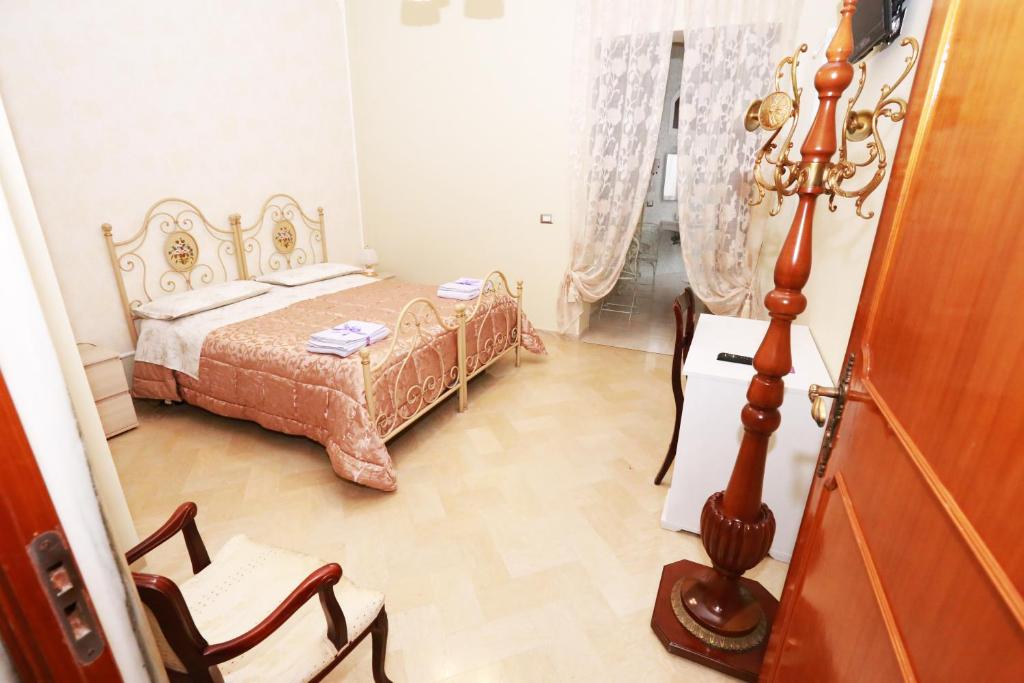 Postel nebo postele na pokoji v ubytování Apulia 70 Holidays - Suites & Experiences