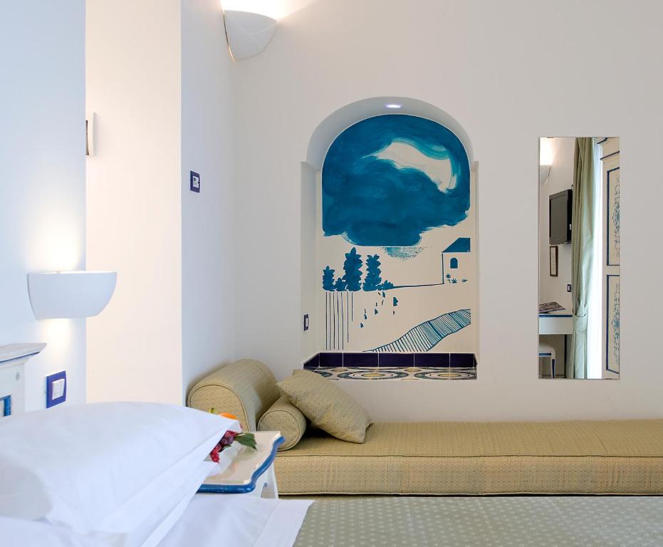 Postel nebo postele na pokoji v ubytování Hotel Margherita