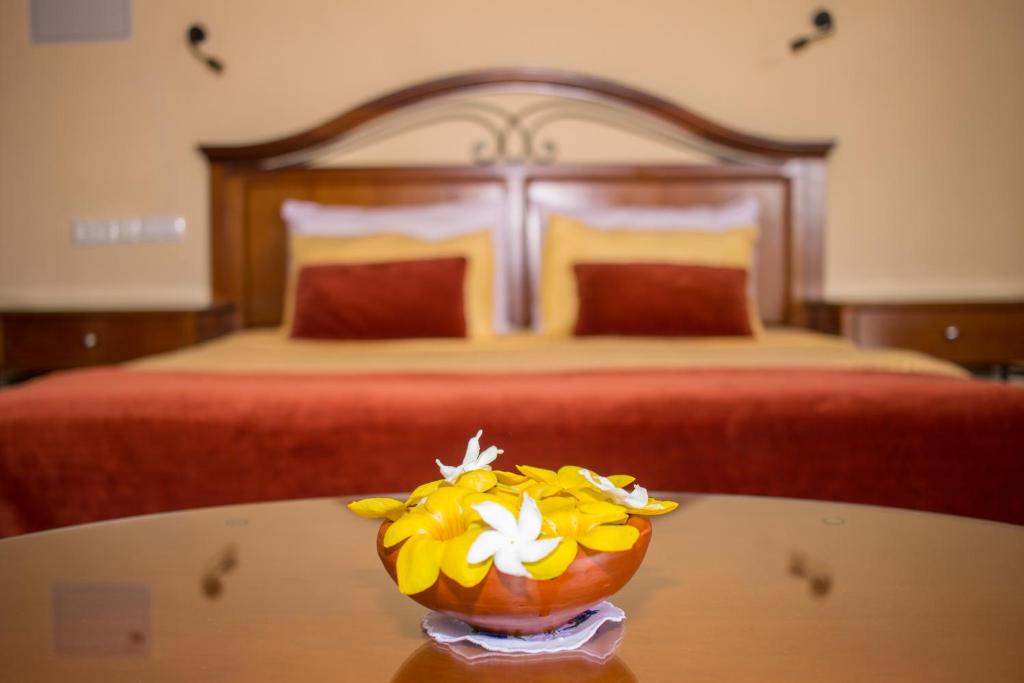 Postel nebo postele na pokoji v ubytování Hotel 4 U Saliya Garden