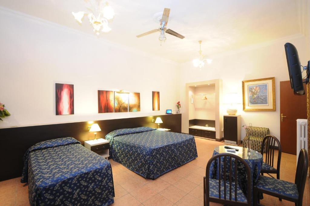 Postel nebo postele na pokoji v ubytování Hotel Sweet Home
