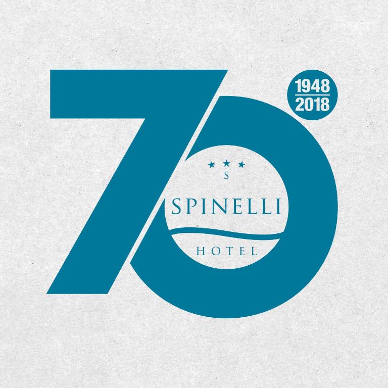 a blue letter k with a symbol for a hotel at Hotel Spinelli in Viareggio