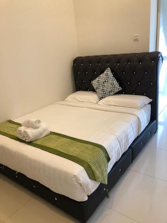 Postel nebo postele na pokoji v ubytování ATS Cameron Hotel & Apartments