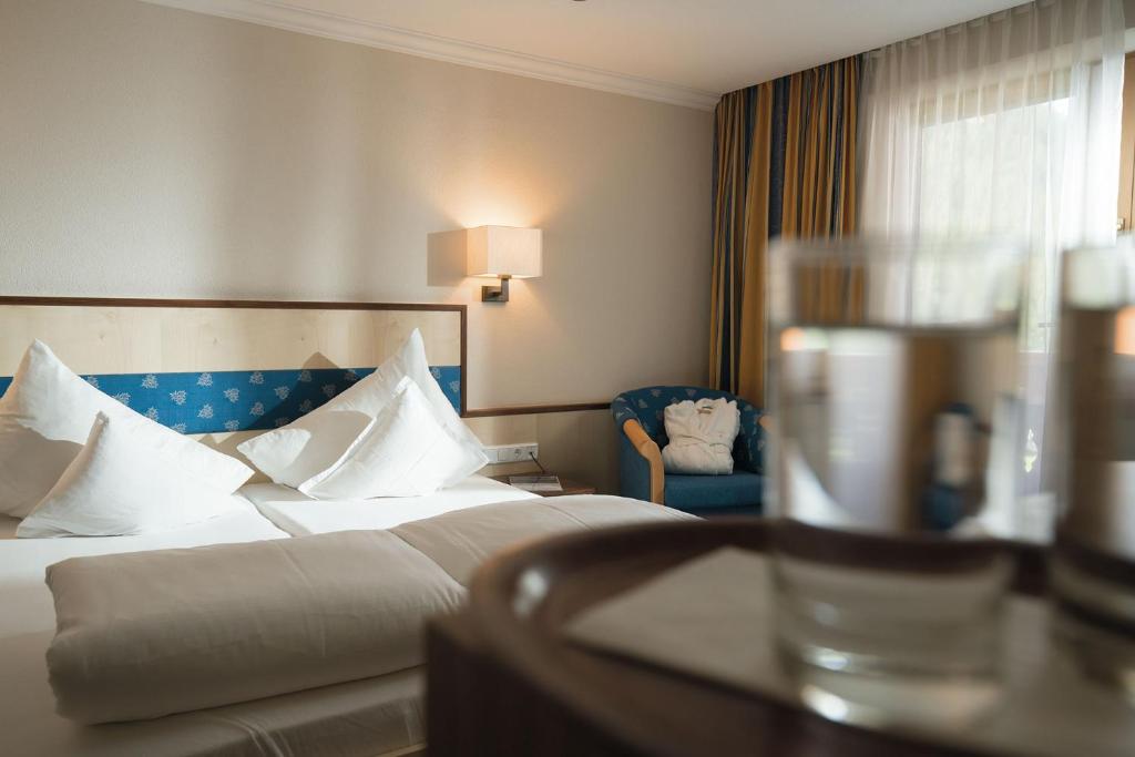 Postel nebo postele na pokoji v ubytování Hotel Gasthof Schöpf