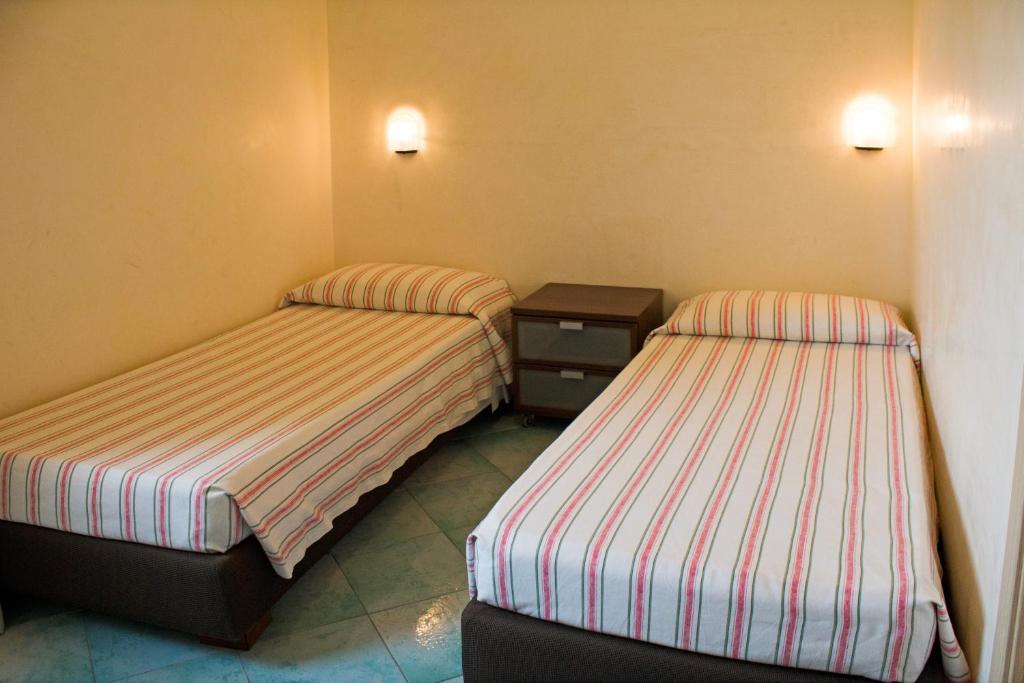 Postel nebo postele na pokoji v ubytování Albergo Villa Anna