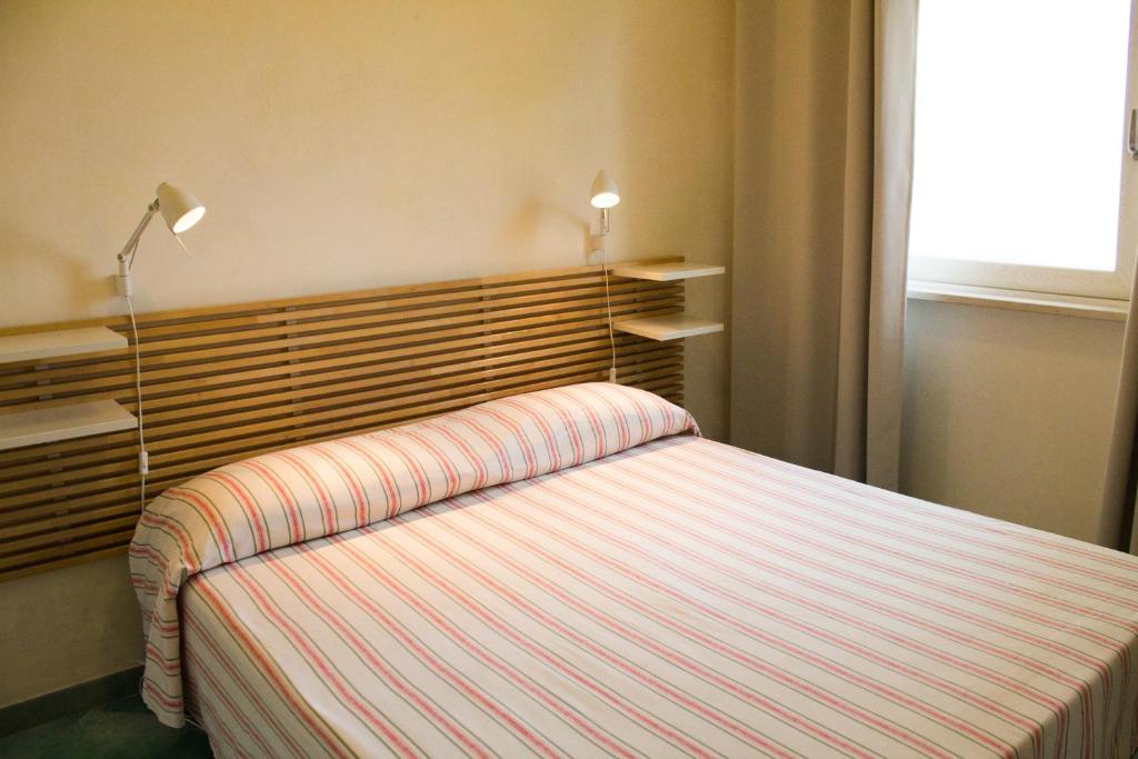 Postel nebo postele na pokoji v ubytování Albergo Villa Anna