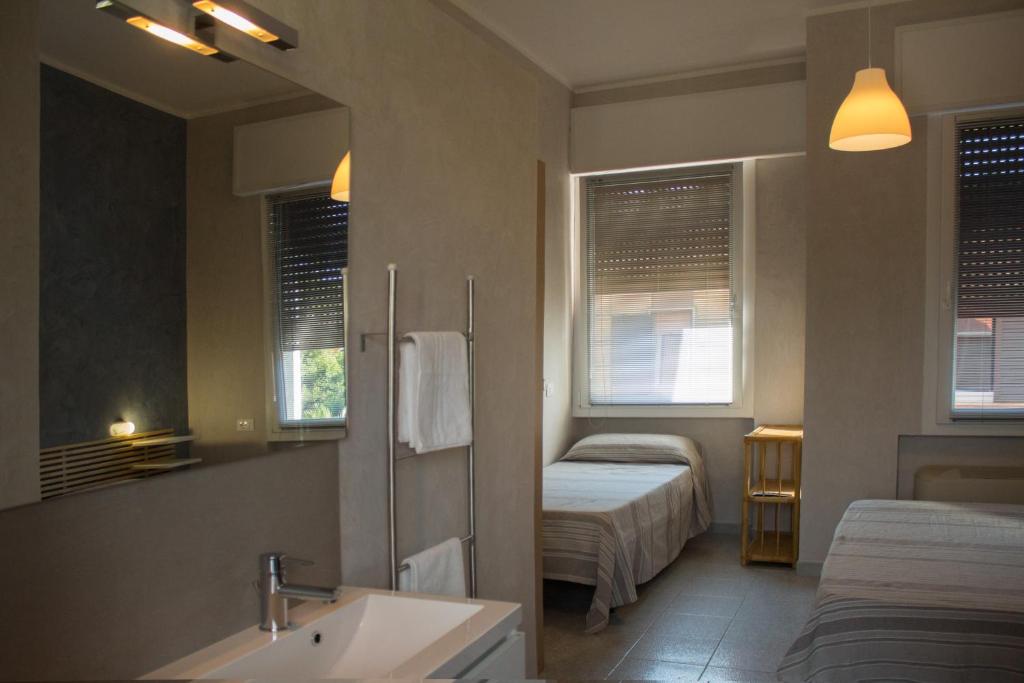Postel nebo postele na pokoji v ubytování Albergo Villa Anna