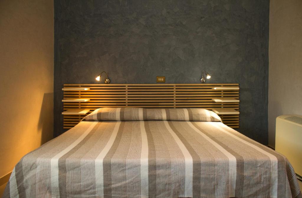 Postel nebo postele na pokoji v ubytování Albergo Villa Anna
