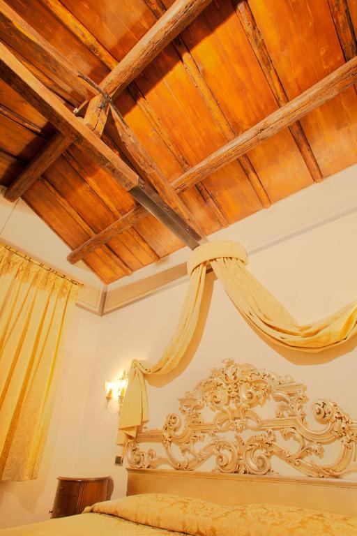 Uma cama ou camas num quarto em Hotel Aventino