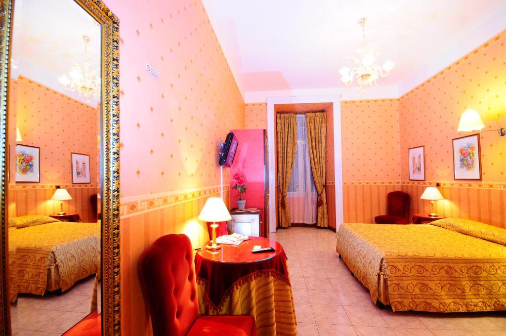 Postel nebo postele na pokoji v ubytování Hotel Sweet Home
