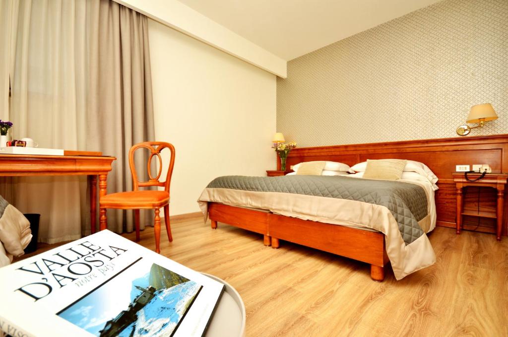 Postel nebo postele na pokoji v ubytování Hotel Diana Jardin et Spa