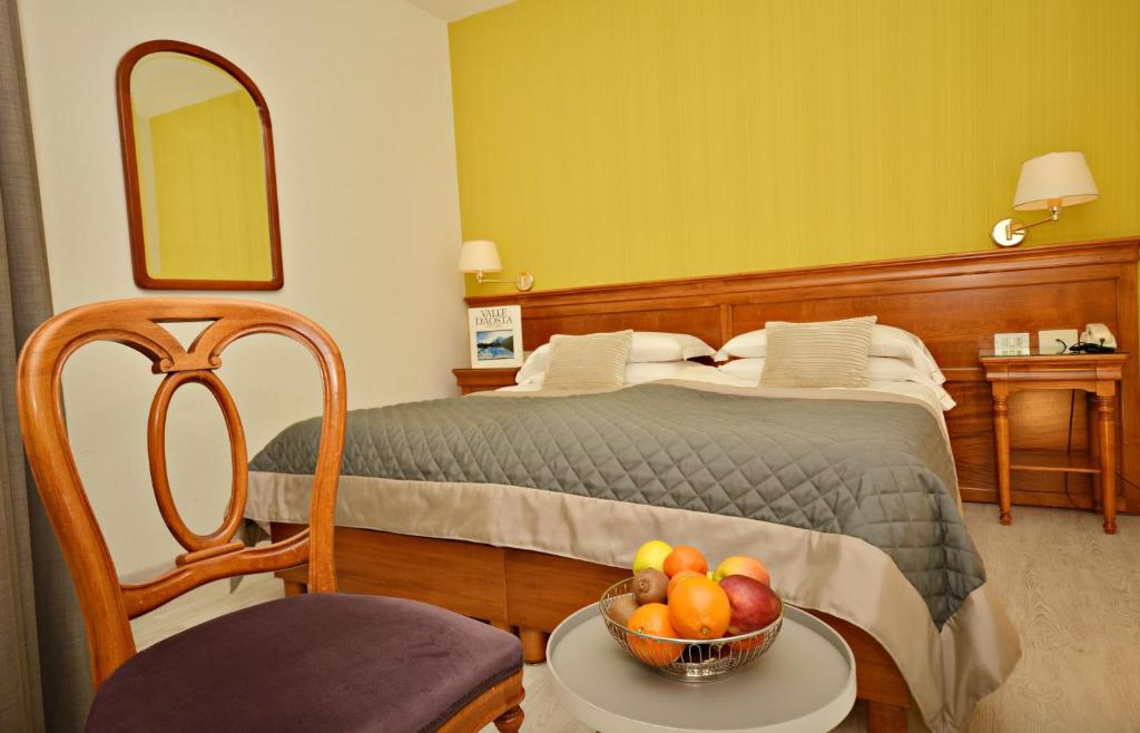 Postel nebo postele na pokoji v ubytování Hotel Diana Jardin et Spa