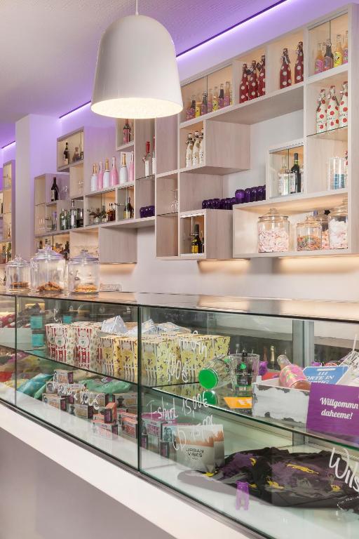 a display case in a store filled with food at INNSiDE by Meliá Leipzig in Leipzig