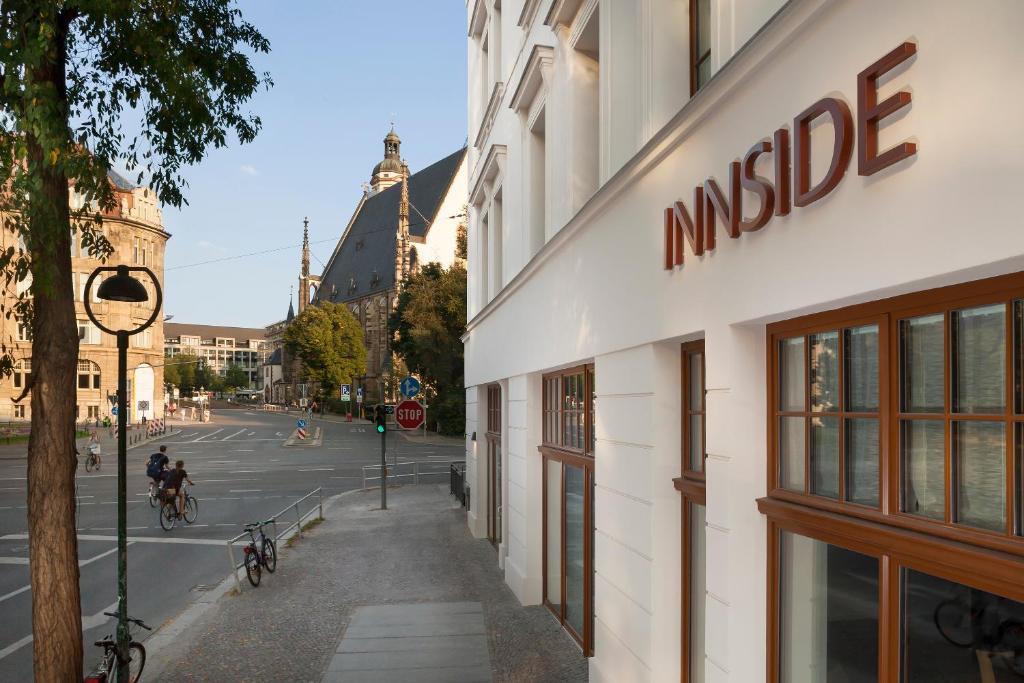 a building with a music sign on the side of a street at INNSiDE by Meliá Leipzig in Leipzig