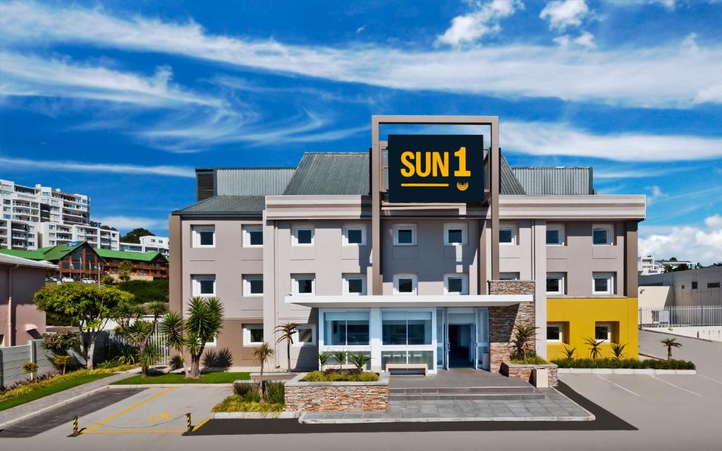 a building with a sign that reads sunil at SUN1 PORT ELIZABETH in Port Elizabeth