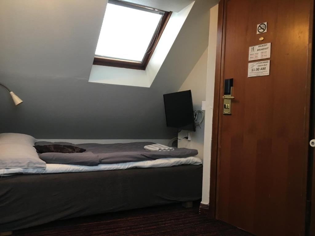 Postel nebo postele na pokoji v ubytování City Hotel Söder