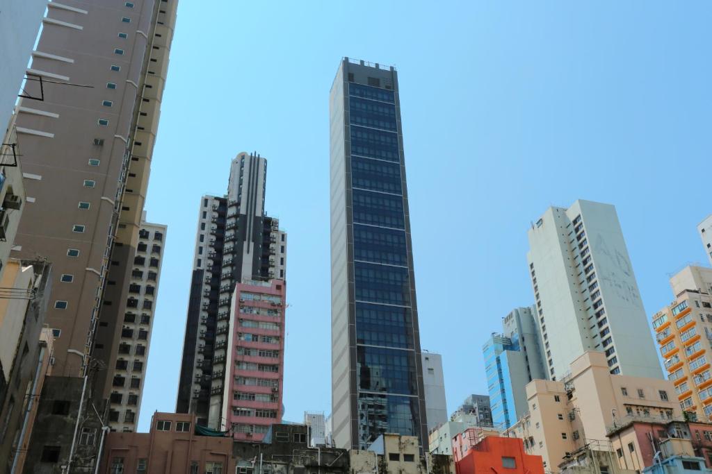 a group of tall buildings in a city at WE Hotel in Hong Kong