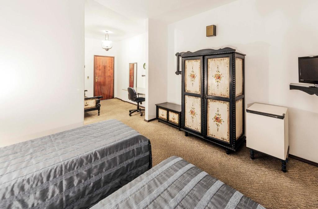 Postel nebo postele na pokoji v ubytování Hotel Tannenhof