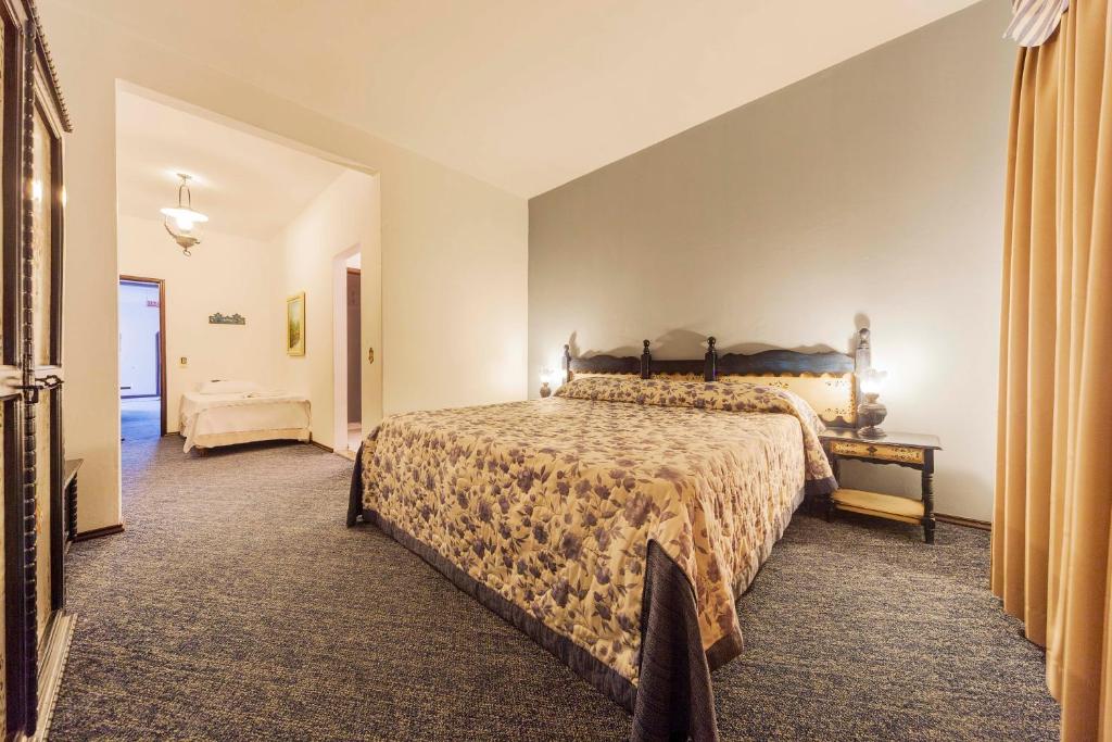 Postel nebo postele na pokoji v ubytování Hotel Tannenhof