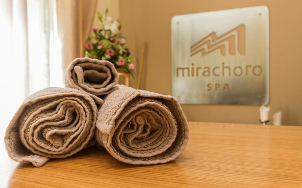 a pair of towels sitting on top of a table at Mirachoro Carvoeiro in Carvoeiro