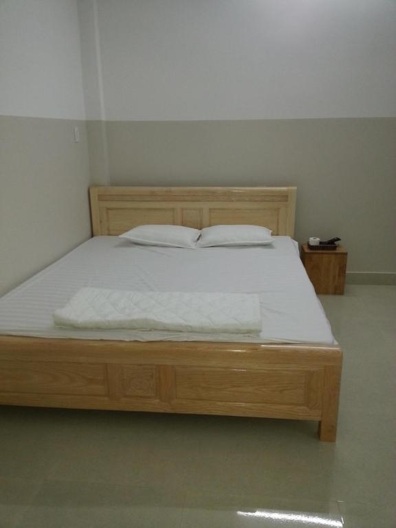 מיטה או מיטות בחדר ב-Phu Loc Motel
