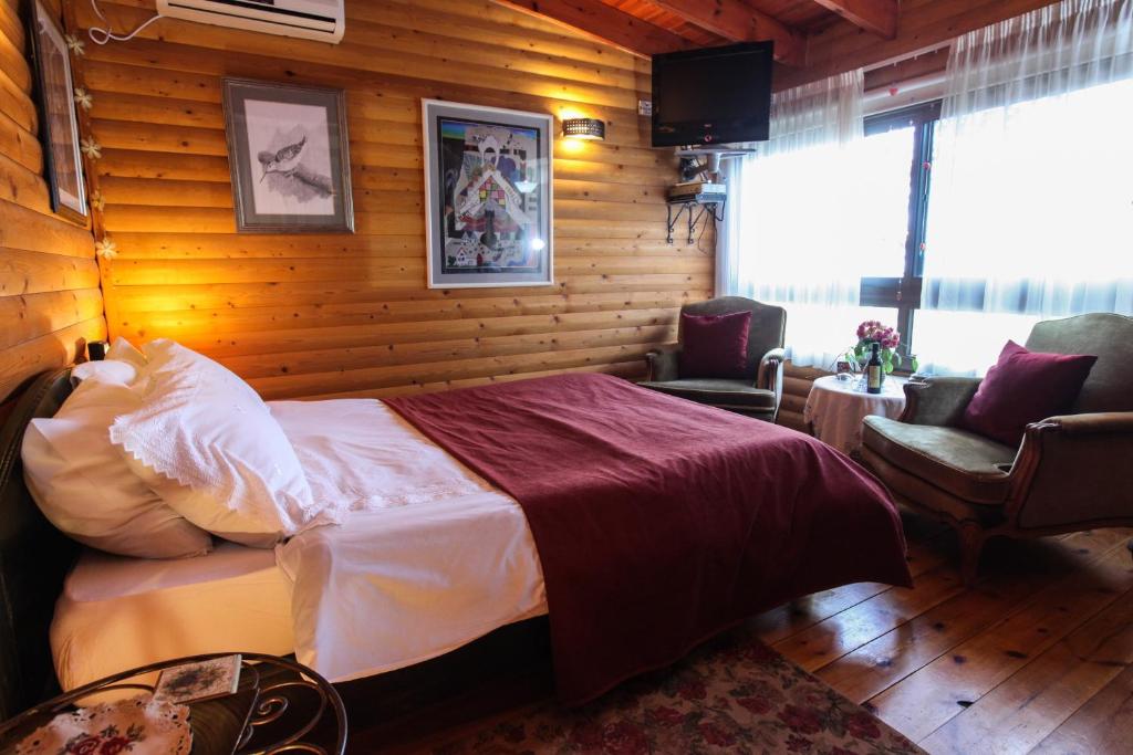 Postel nebo postele na pokoji v ubytování Havaya Ba Nof Lodge