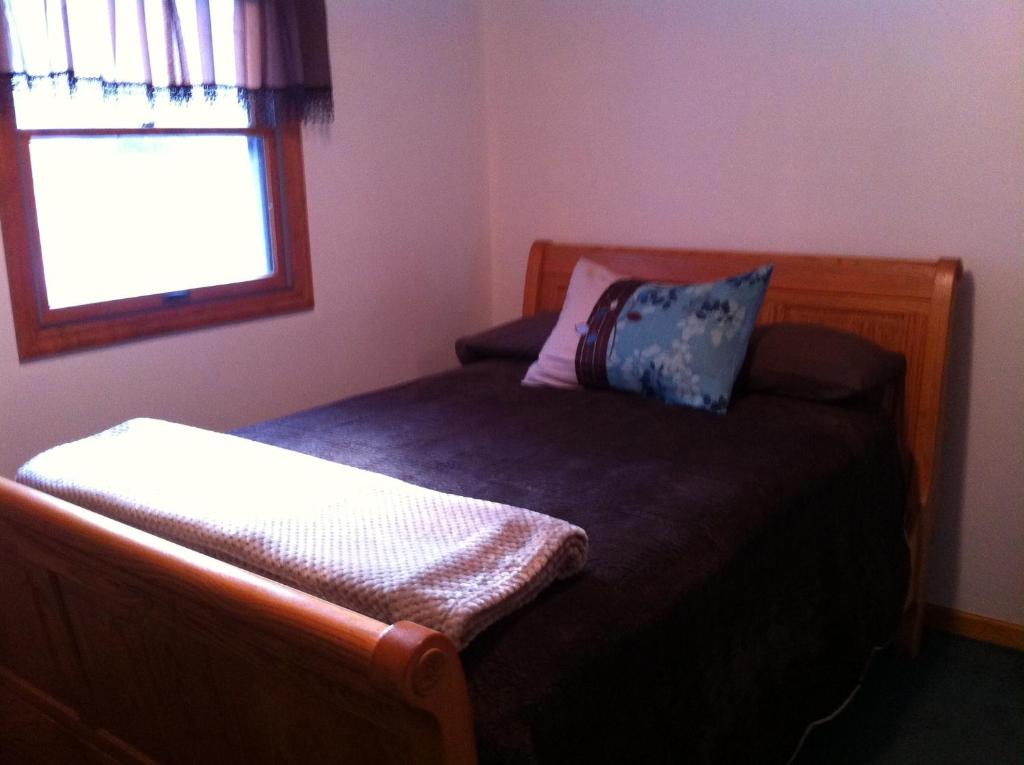 Ένα ή περισσότερα κρεβάτια σε δωμάτιο στο Whispering Meadow